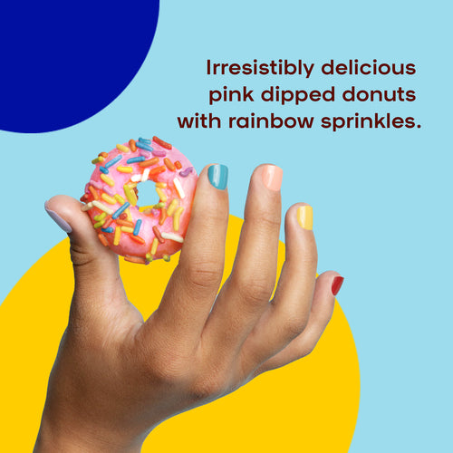 A hand holding up a pink dipped donut