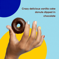 Hand holding each flavor of donutful donuts: chocolate, pink and vanilla